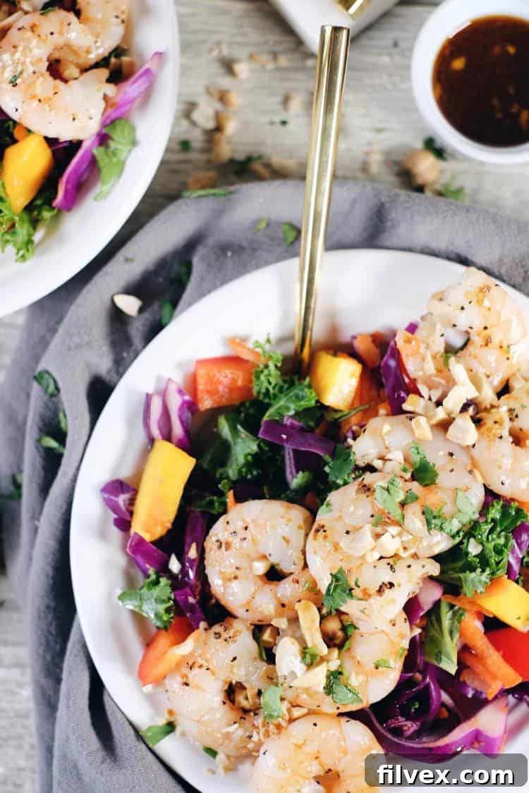 A close-up of the fresh shrimp cooking in a skillet, ready to be added to the Thai salad.