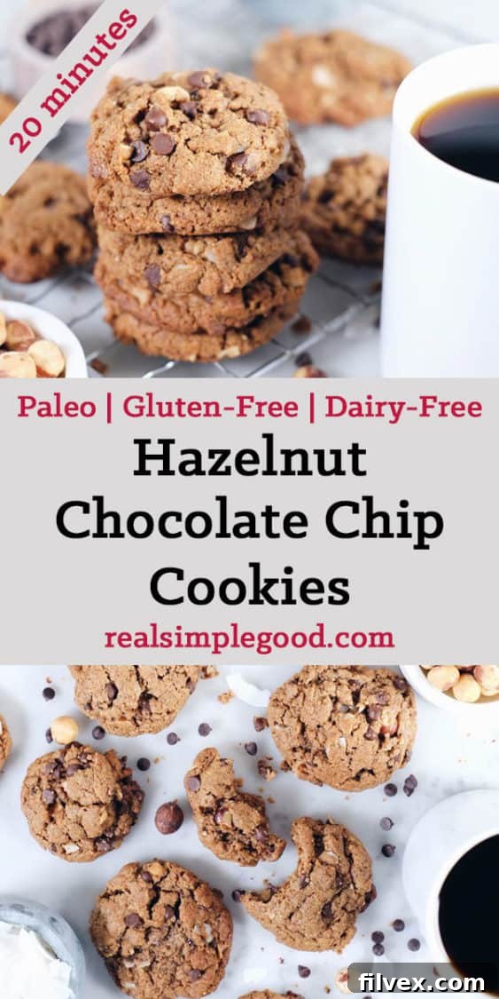 A stack of golden brown Hazelnut Chocolate Chip Cookies on a plate, with a bite taken out of one. | realsimplegood.com