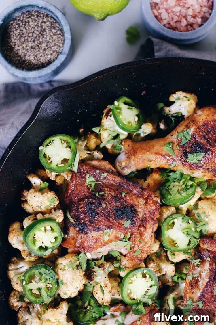 Crispy chicken thighs with vibrant zesty cauliflower, an ideal Paleo and Whole30 recipe loaded with citrus, cilantro, and jalapeño flavor.