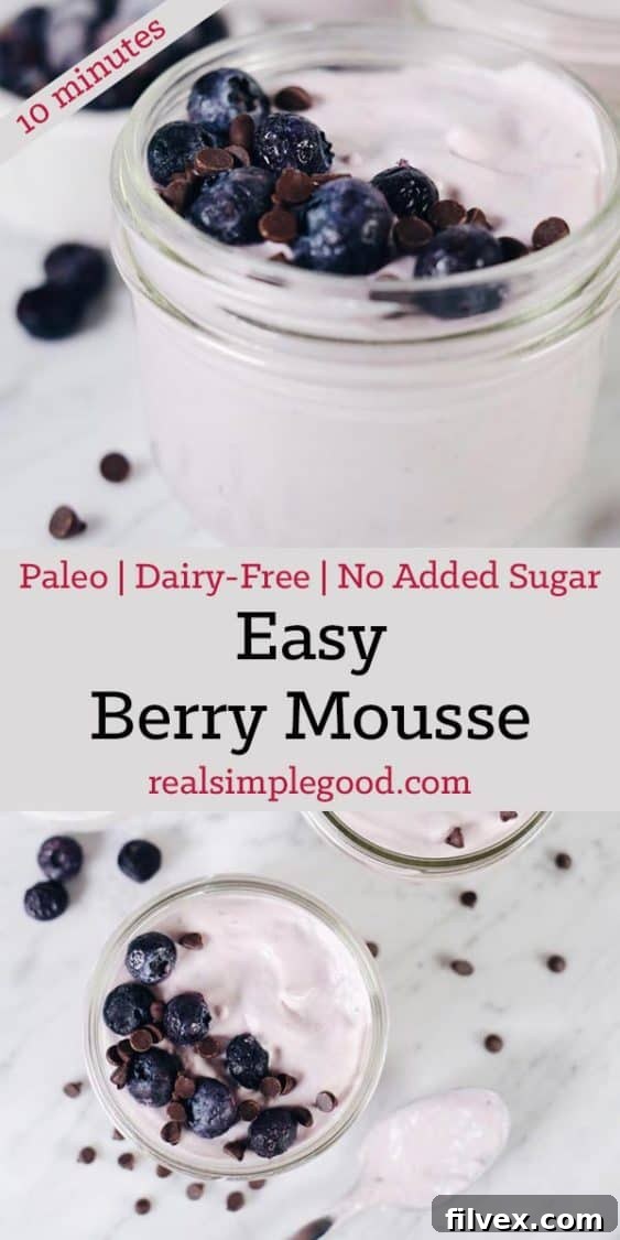 Five glasses of Easy Paleo Berry Mousse, garnished with fresh berries, ready to be served.