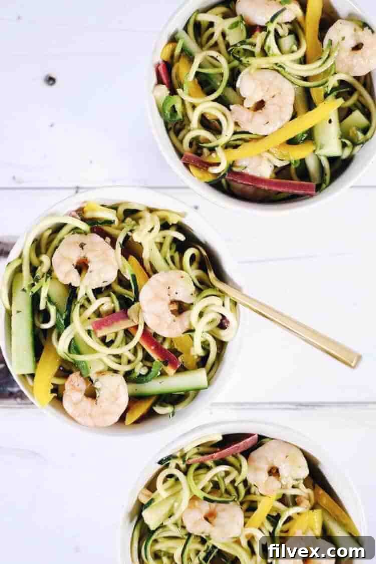 This vibrant Shrimp Zoodle Spring Roll Bowl is bursting with fresh flavors and beautiful colors. It's a light, refreshing, yet incredibly satisfying meal that's Paleo, Whole30, Gluten-Free, Soy-Free, and Dairy-Free, making it perfect for a healthy lifestyle.