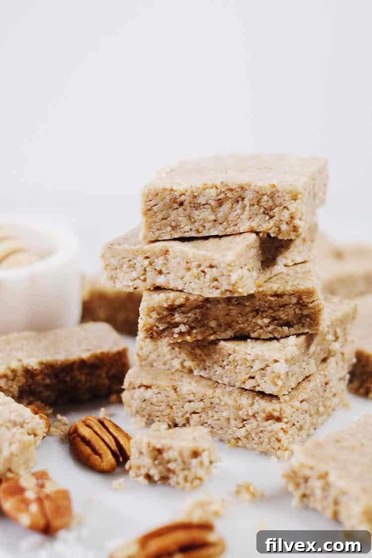 Prepared no-bake honey nut bars chilling in a pan, showcasing the easy, minimal-effort recipe process.