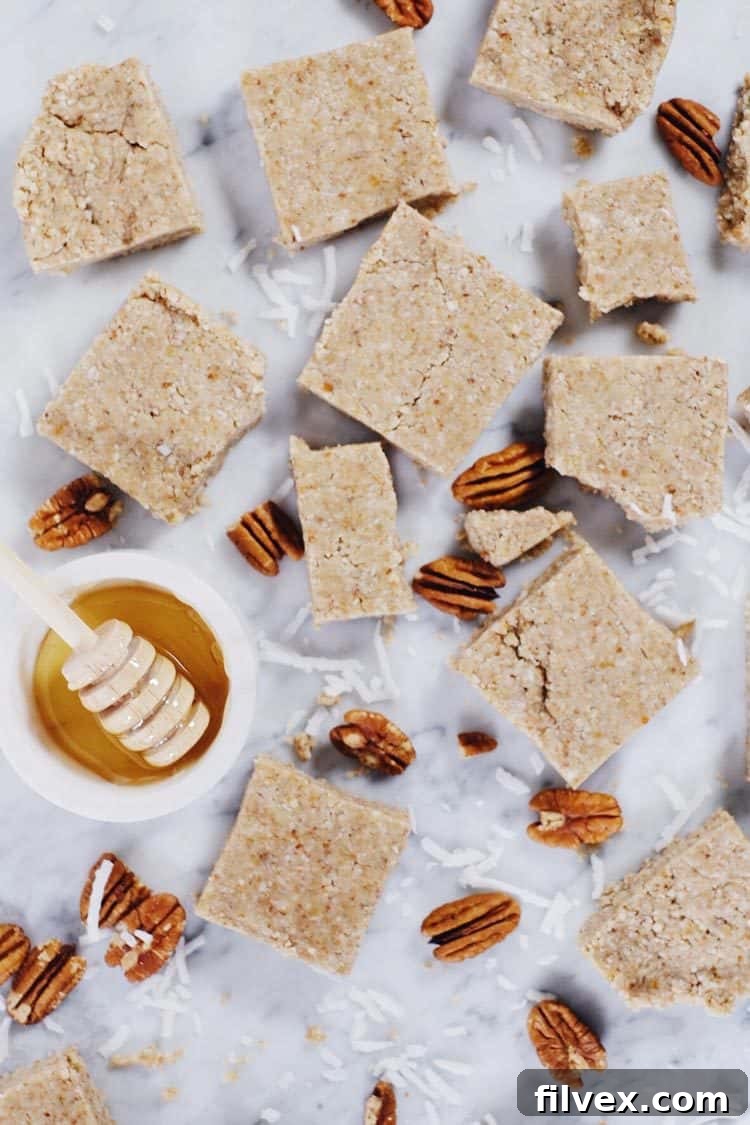 No-bake honey nut bars sweetened with raw honey, emphasizing natural ingredients and adjustable sweetness.