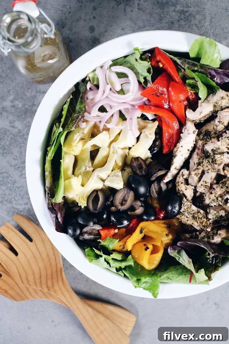 A large bowl of Mediterranean Chicken Salad, ready to be served, highlighting the easy and quick assembly process.