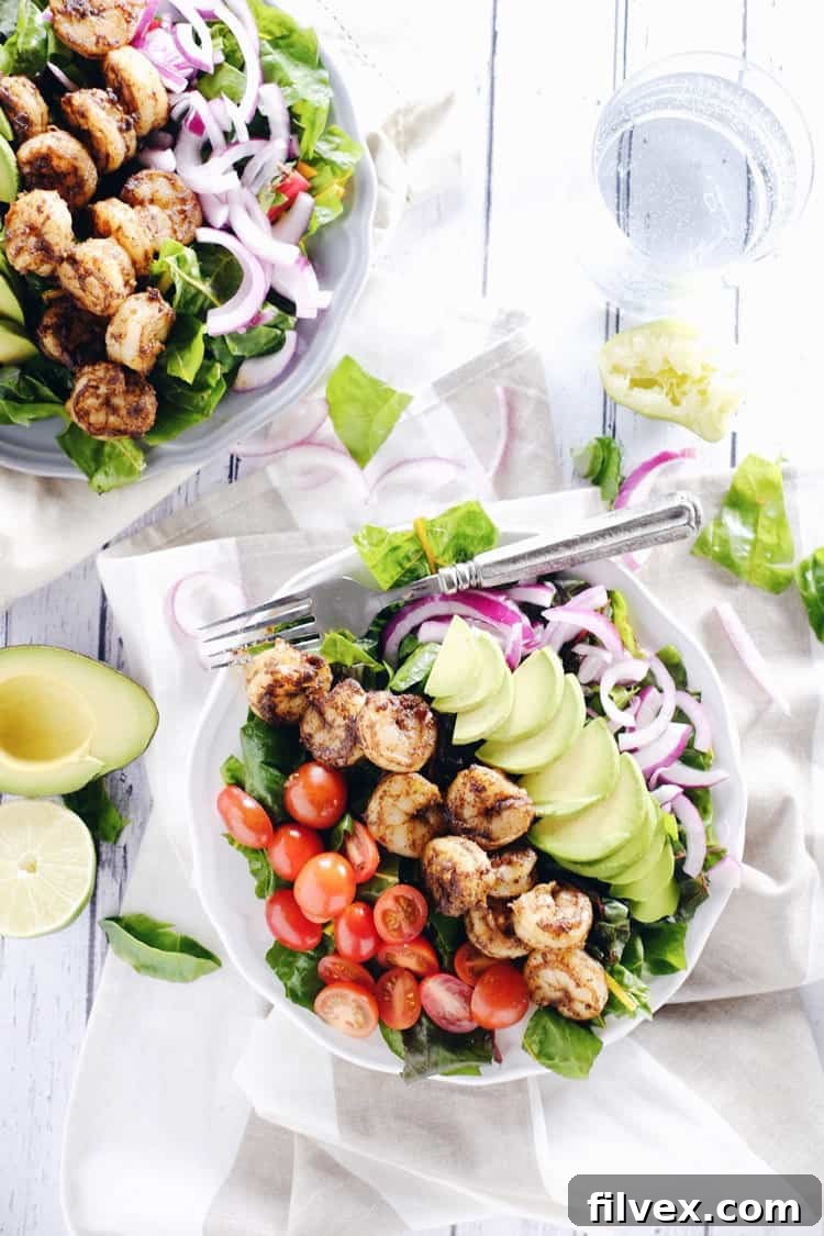 Vibrant Cajun shrimp salad with fresh vegetables.