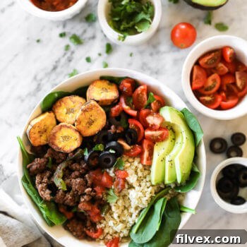 Delicious ground beef taco bowls with cauliflower rice and fresh toppings.