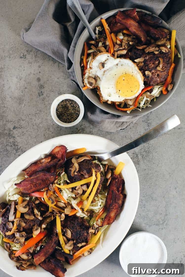 Chipotle Beef Paleo Burger Bowls: A quick and easy, spiced-up burger alternative, perfect for Paleo, Whole30, and Keto diets. Features colorful toppings and a runny egg. realsimplegood.com