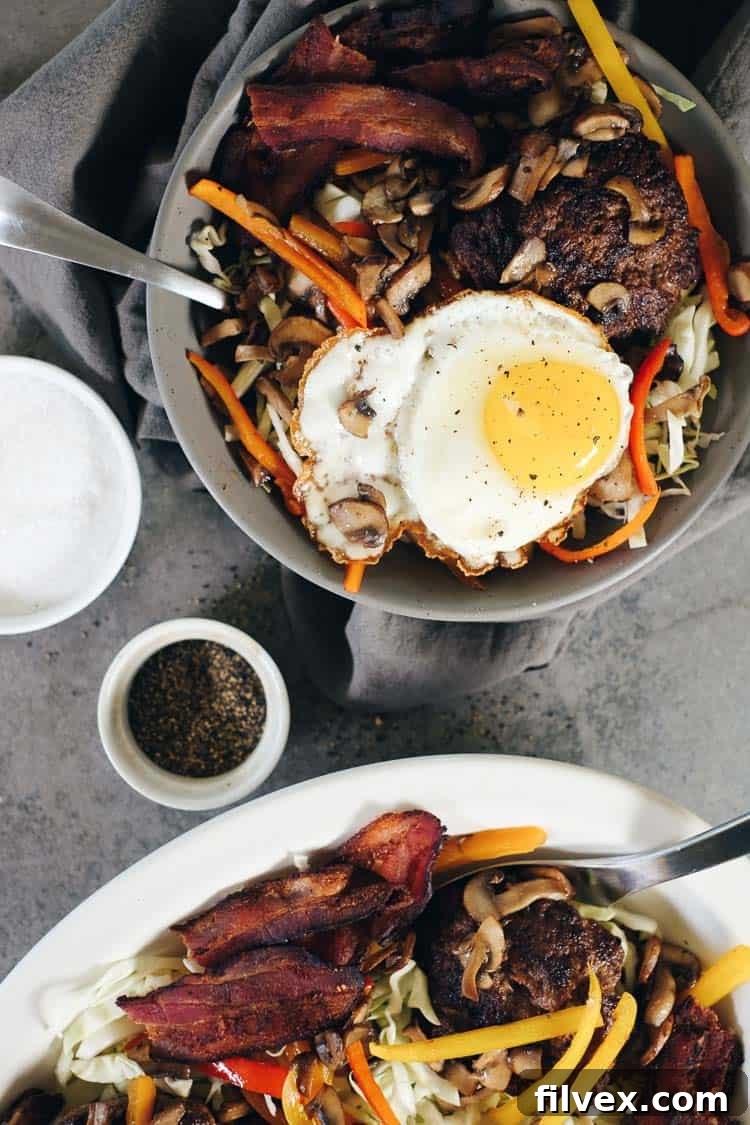Enjoy the full flavor of a deconstructed burger in a bowl with Chipotle Beef Paleo Burger Bowls. Features savory beef, sautéed veggies, and a runny egg. Paleo + Whole30 | realsimplegood.com
