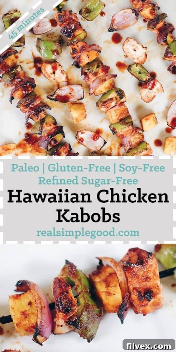 A serving of Hawaiian chicken kabobs on a plate, garnished with fresh herbs, showcasing the grilled chicken, pineapple, and bell peppers.