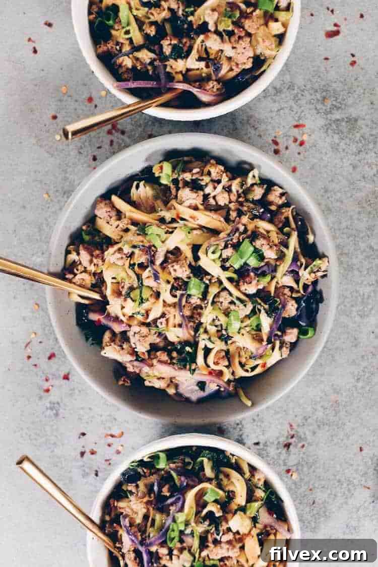 These Paleo potsticker noodle bowls are the BEST! Filled with cruciferous veggies, grain-free pasta and deliciously seasoned ground pork! Paleo, Gluten-Free, Dairy-Free + Soy-Free. | realsimplegood.com