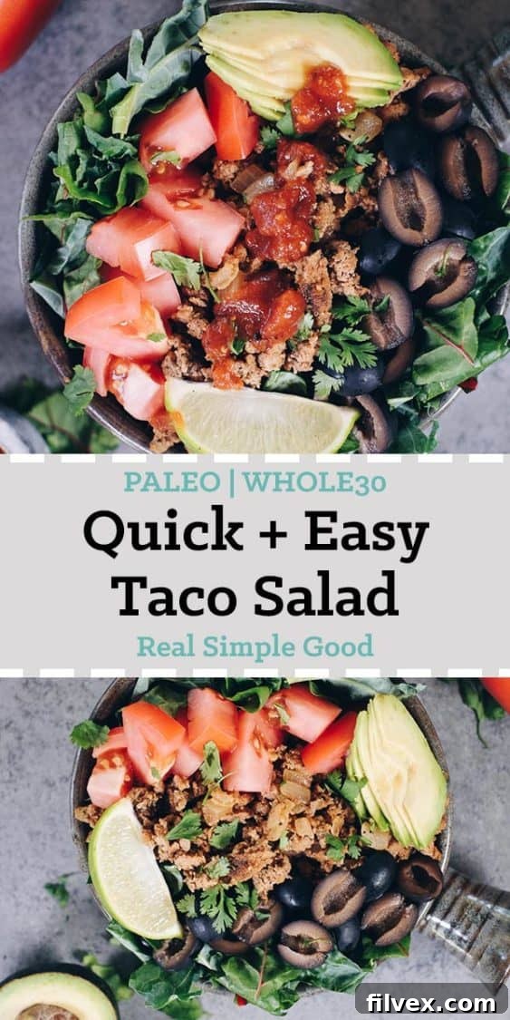 A generous serving of Paleo Taco Salad with ground turkey, fresh greens, and colorful toppings, viewed from an angle, perfect for sharing on social media.