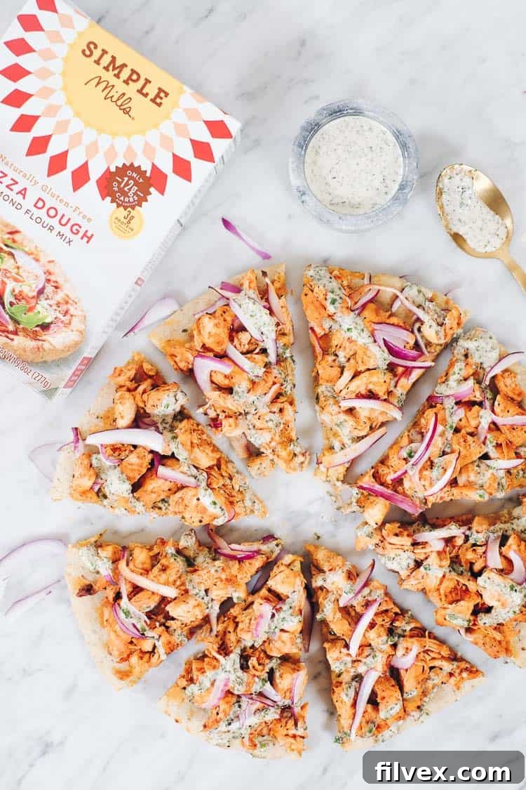 Close-up of the perfectly baked crust on a Buffalo Ranch Chicken Pizza made with Simple Mills pizza dough mix. | realsimplegood.com