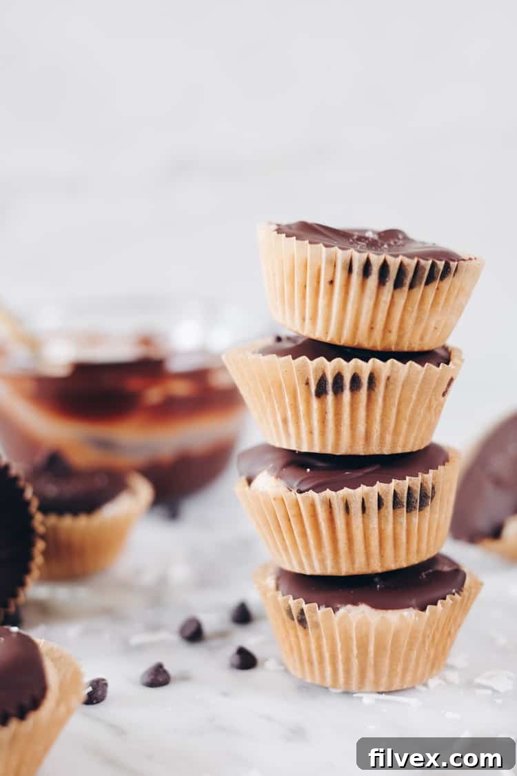 Delicious Paleo Coconut Butter Cups, a perfect two-bite sized salty-sweet treat that's gluten-free and dairy-free.