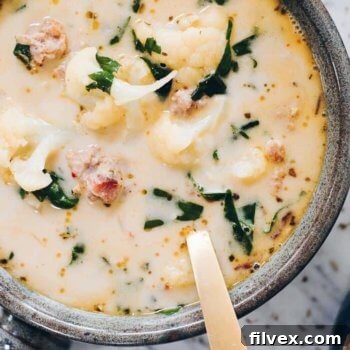 overhead image of healthy zuppa toscana in a pot with kale, sausage and cauliflower