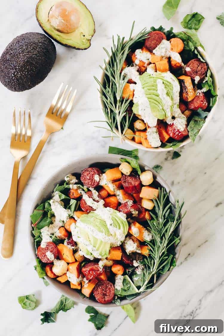 Customizable Sheet Pan Roasted Sausage and Vegetables meal, shown with optional fried eggs, suitable for breakfast, lunch, or dinner on a Paleo and Whole30 diet.