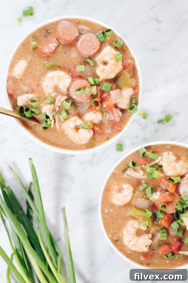 Our Paleo Gumbo is loaded with succulent chicken thighs, savory sausage, and fresh shrimp, all simmered with a generous array of vegetables and expertly blended seasonings. This delightful recipe is also Whole30 and Keto compliant, offering a healthy yet hearty meal option. | realsimplegood.com