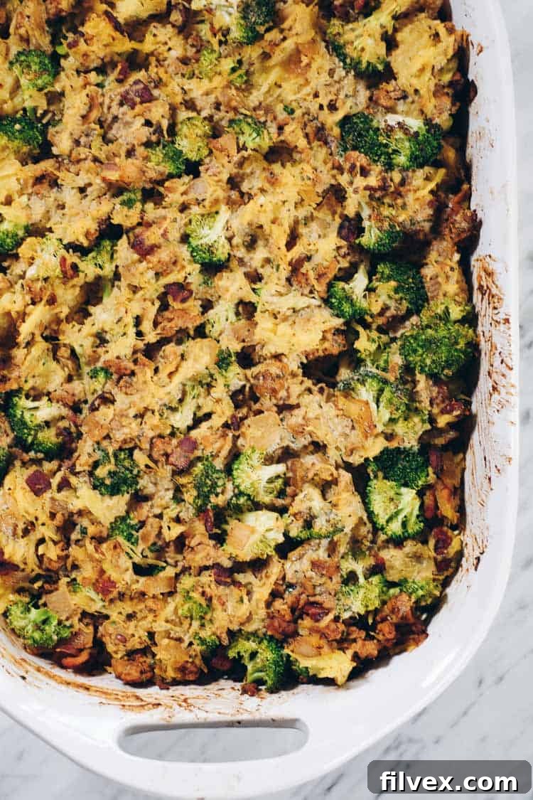 Overview of raw ingredients for the casserole, including spaghetti squash, ground chicken, bacon, broccoli, and seasonings.