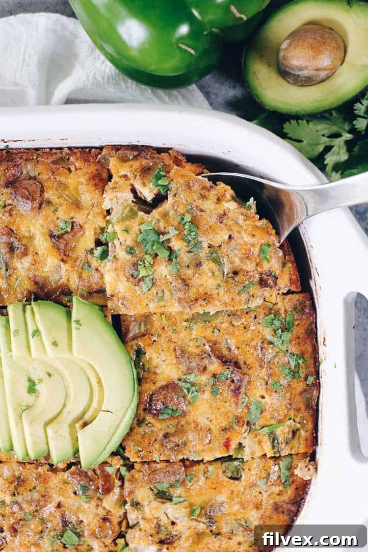 Experience the full flavor of a breakfast burrito, sans tortilla, with this Paleo and Whole30 Casserole. Eggs, sausage, potatoes, and fresh veggies unite for a perfect meal.
