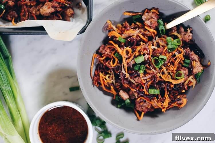 Enjoy the delicious flavors and textures of this Paleo and Whole30 Sheet Pan Crispy Vegetable Noodles and Pork recipe! You will crave the leftovers! | realsimplegood.com