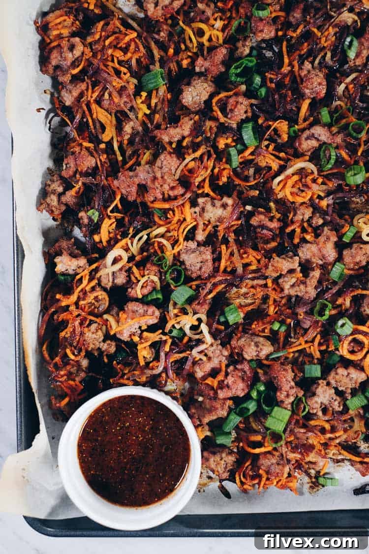 Enjoy the delicious flavors and textures of this Paleo and Whole30 Sheet Pan Crispy Vegetable Noodles and Pork recipe! You will crave the leftovers! | realsimplegood.com