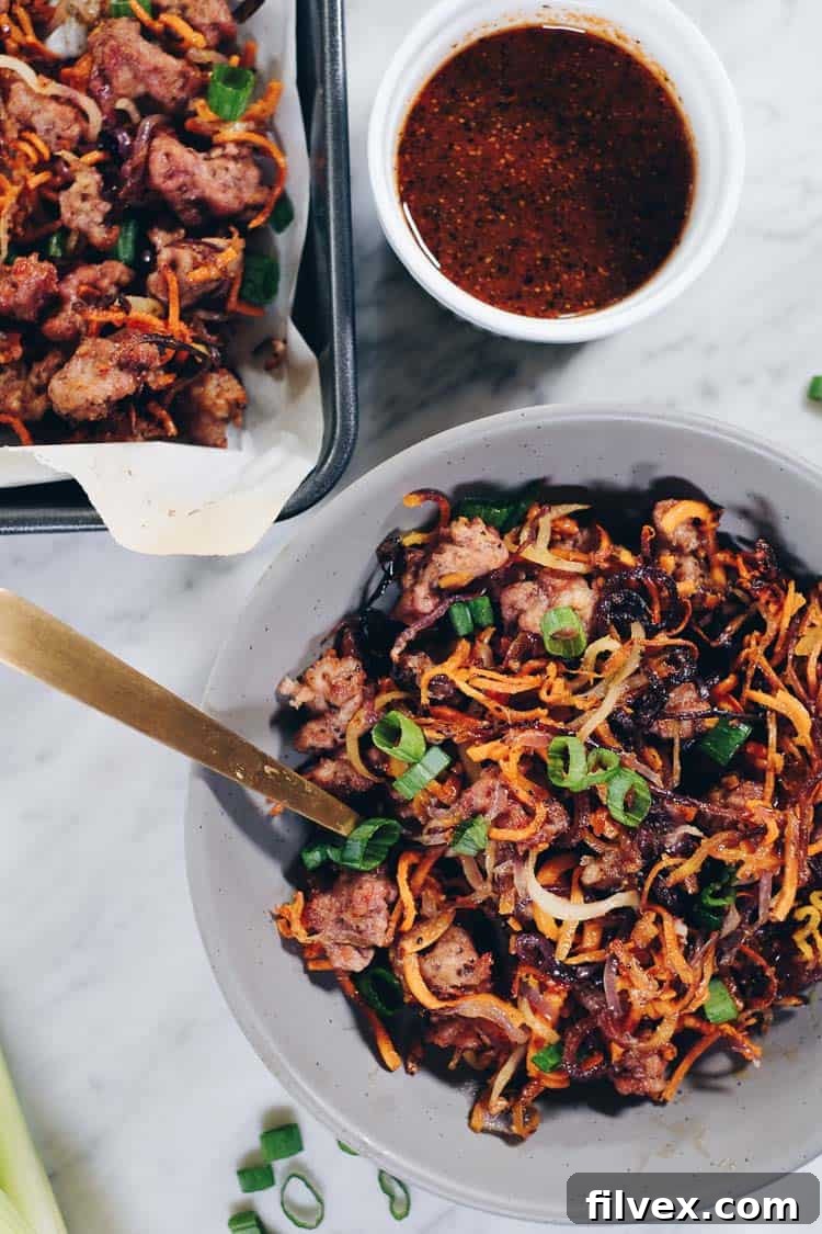 Enjoy the delicious flavors and textures of this Paleo and Whole30 Sheet Pan Crispy Vegetable Noodles and Pork recipe! You will crave the leftovers! | realsimplegood.com