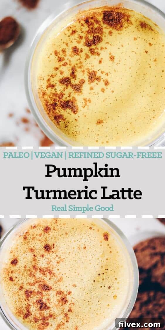 Full-length shot of a Pumpkin Turmeric Latte in a stylish mug, with subtle autumn decor in the background. A delicious dairy-free, caffeine-free, Paleo, Vegan, and Refined Sugar-Free holiday beverage from realsimplegood.com.
