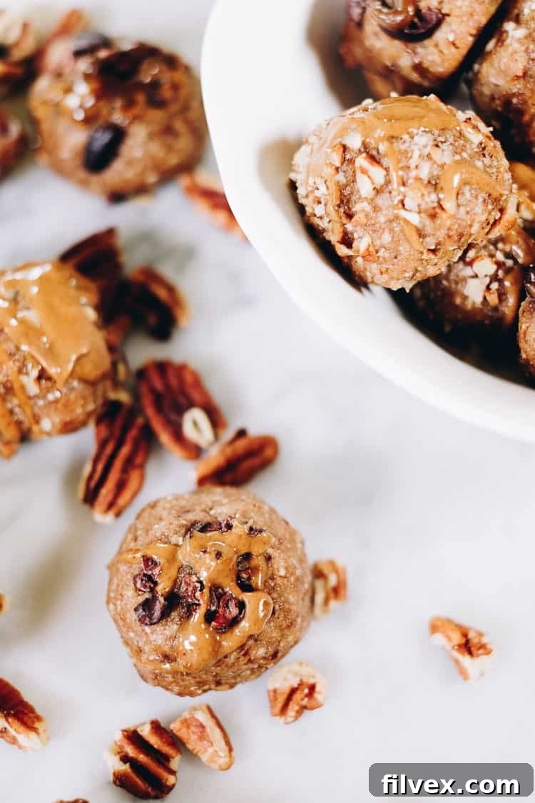 A variety of Pecan Date Energy Bites with different toppings, showcasing their versatility and appeal as a healthy snack.
