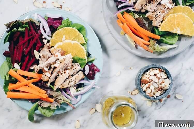 Colorful chicken and beet salad with orange slices, a perfect Whole30 recipe