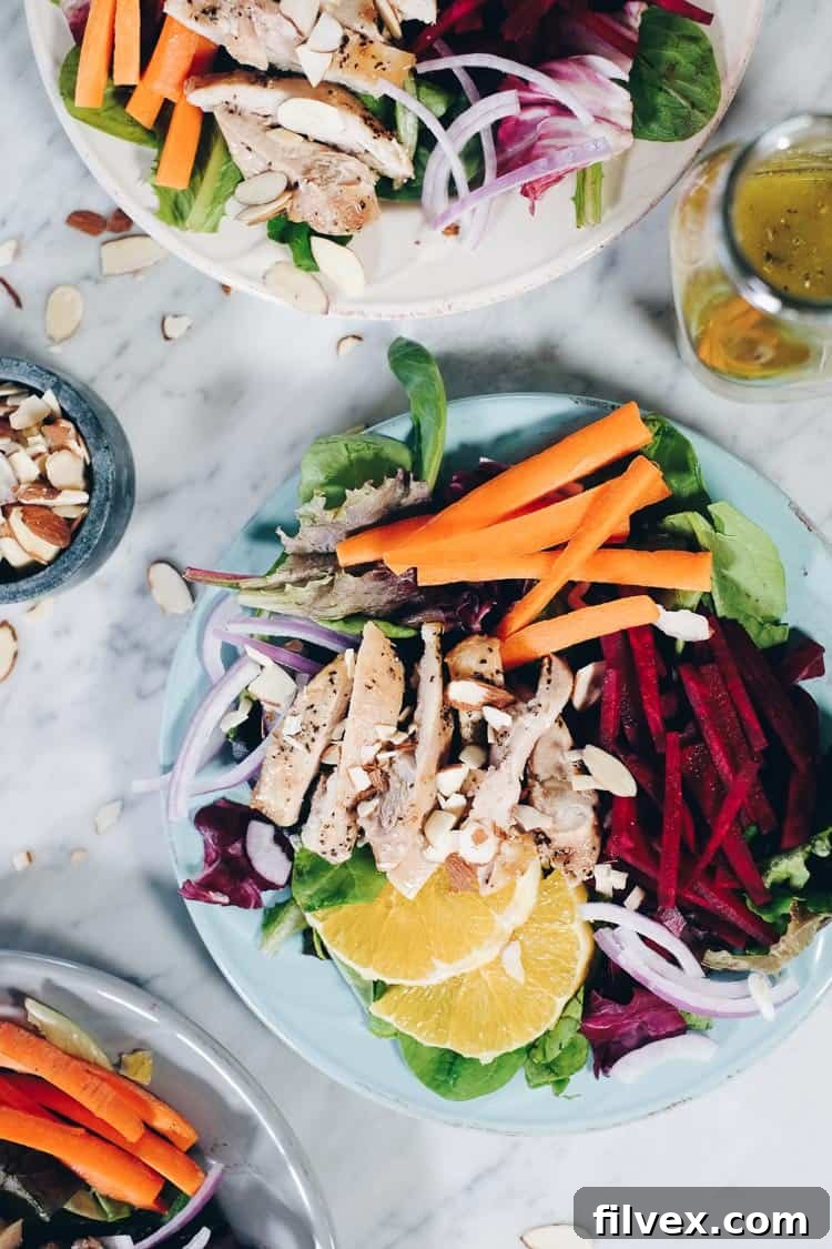 Close-up of vibrant chicken and beet salad with citrus dressing, ideal for Whole30