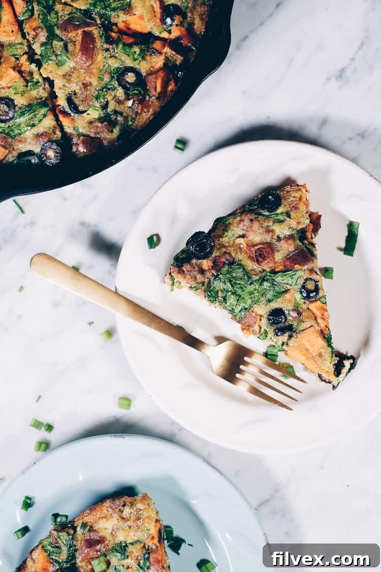 This Paleo + Whole30 sausage and sweet potato frittata is filling and full of the delicious flavors of sausage, sweet potatoes, olives and green onions. It will keep you going all morning! #paleo #whole30 #glutenfree #dairyfree #breakfast | realsimplegood.com