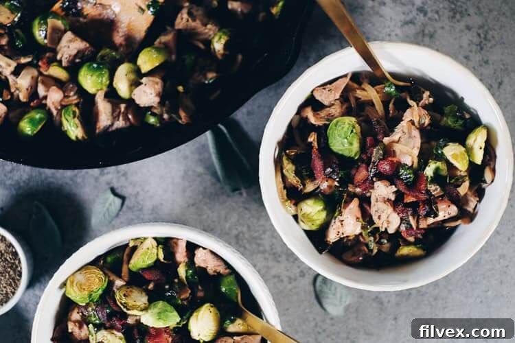 This Paleo + Whole30 Creamy Bacon Chicken and Brussels Sprouts Skillet is a must-try. It's packed with dairy-free, creamy goodness that perfectly complements the salty bacon. A fantastic #paleolife #whole30 #recipe #dairyfree #glutenfree | realsimplegood.com