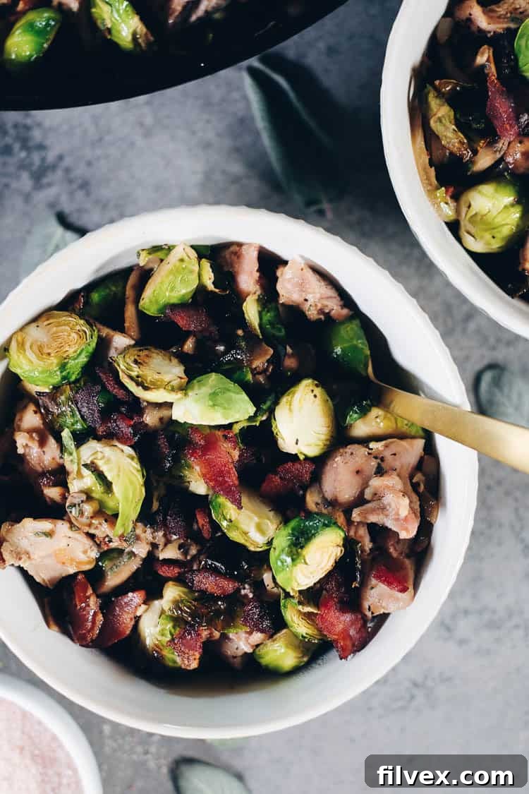 The perfect pairing: roasted brussels sprouts and crispy bacon mingled in a creamy skillet. A satisfying #paleolife #whole30 #recipe #dairyfree #glutenfree dish. | realsimplegood.com