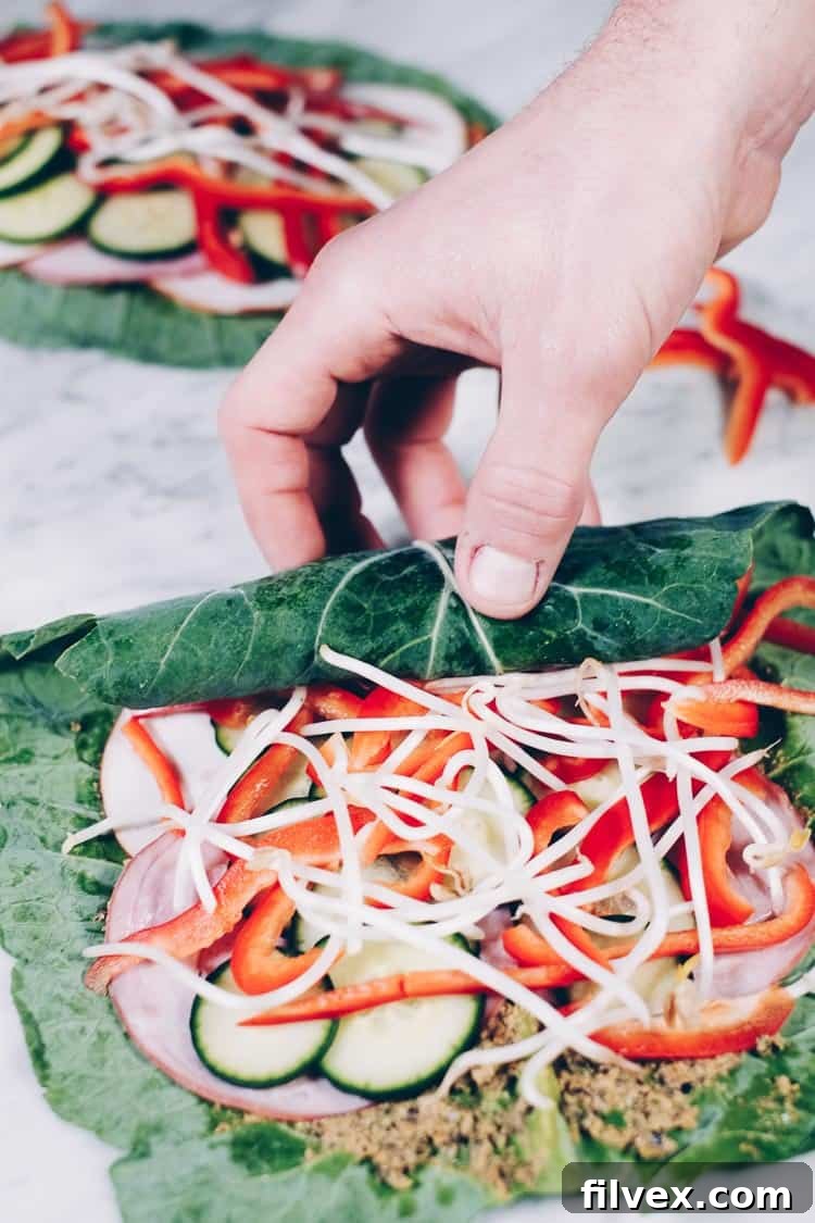 A selection of fresh, clean ingredients including a homemade, creamy spread, meticulously arranged and ready for assembling healthy collard green wraps. Highlights the fresh components.