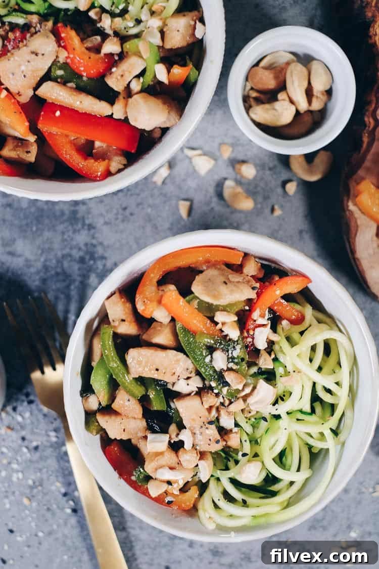 Freshly spiralized zucchini noodles ready for a healthy teriyaki bowl