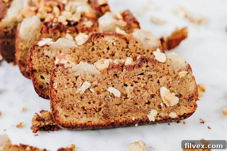 Freshly baked Paleo Vegan Banana Bread cooling on a wire rack.
