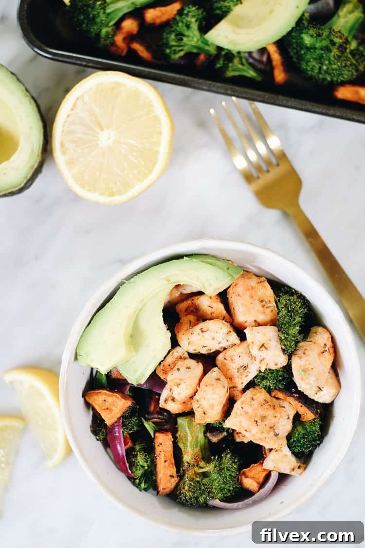 Vibrant and healthy Paleo Whole30 chicken sweet potato bake, featuring roasted chicken, sweet potatoes, broccoli, and red onion. #paleo #whole30 #sheetpan #onepan | realsimplegood.com