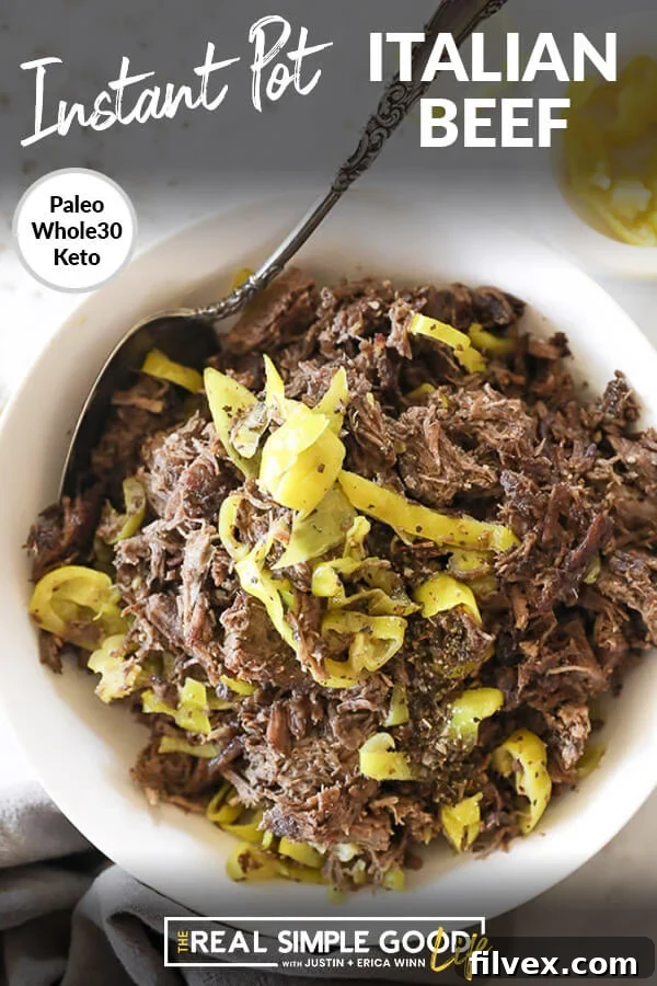 Instant pot italian beef shredded in a bowl with peppers and spoon vertical overhead image with text at top
