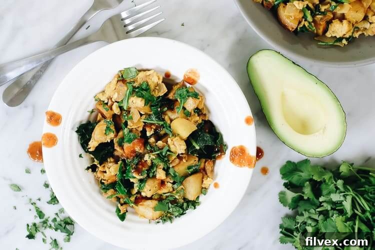 Close-up of vibrant Chorizo and Eggs hash with fresh cilantro, a perfect Paleo and Whole30 breakfast.