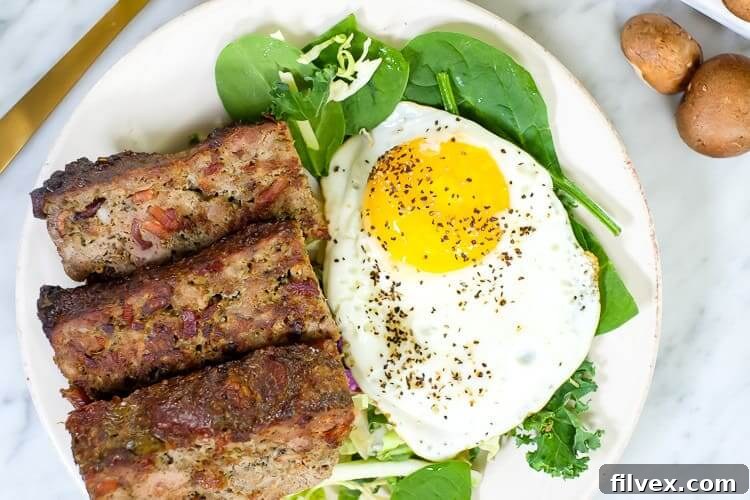 Breakfast meatloaf with bacon horizontal overhead with egg