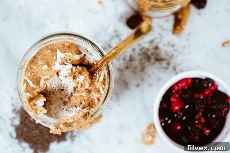 Overhead horizontal shot of "PB" and Jelly Overnight Oats, ready for a healthy and convenient breakfast.