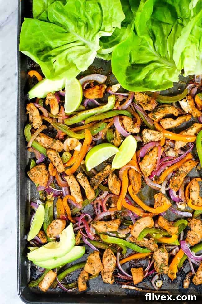 Sheet pan chicken fajita bake with avocado, lime, cilantro and butter lettuce.