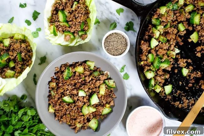 This is a Thai larb recipe with ground pork or chicken, cucumber and some seasonings. Served in a bowl and in cabbage shells. 