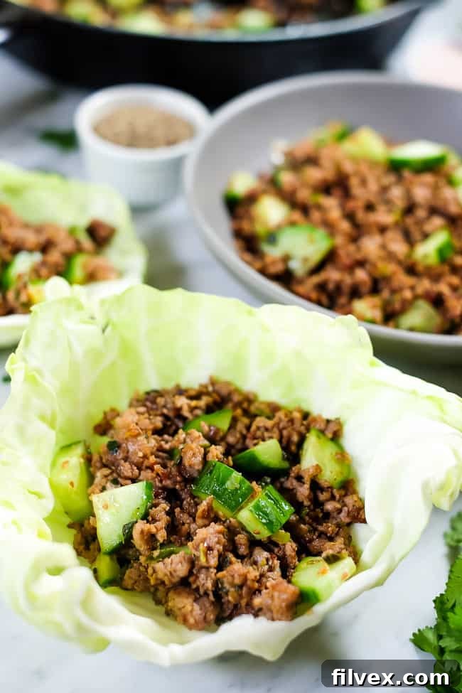 This is a Thai larb recipe with ground pork or chicken, cucumber and some seasonings. Shown served in a cabbage shell. 