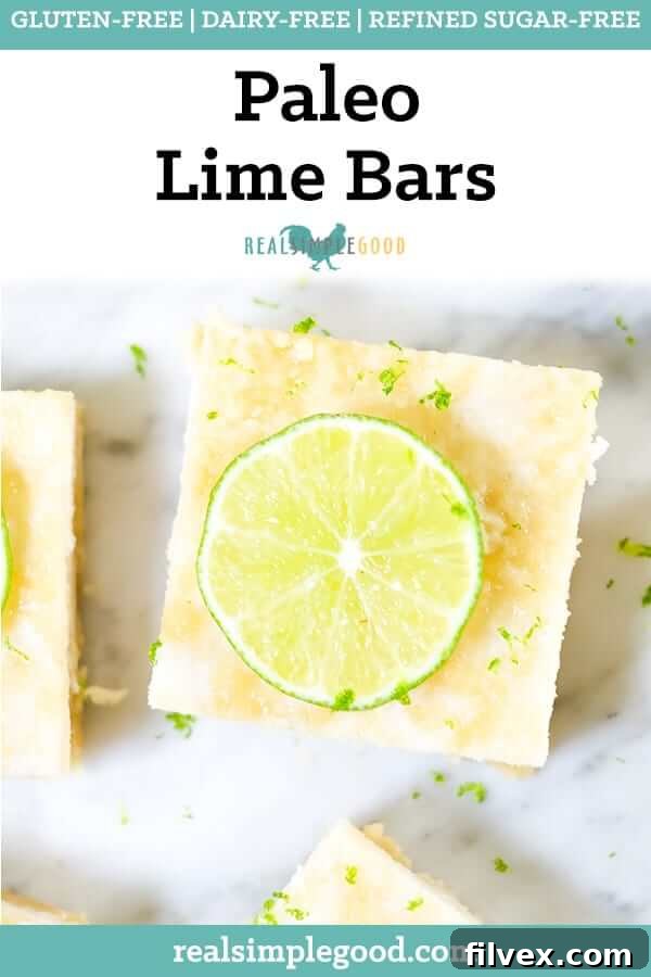 Delicious Paleo Lime Bars (GF, Dairy-Free + Refined Sugar-Free) on a rustic cutting board, garnished with lime slices. A refreshing and healthy dessert.