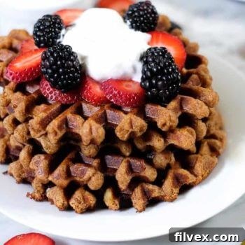Close-up of fluffy Paleo waffles with fresh fruit