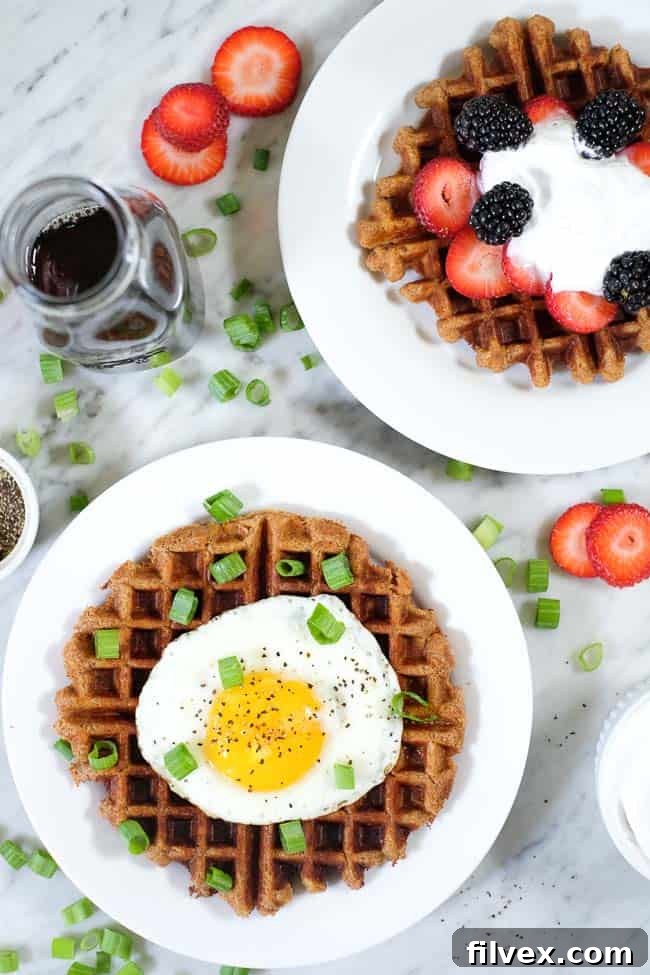 A delicious comparison: one Paleo waffle adorned with sweet berries and coconut whipped cream, alongside another featuring a savory fried egg and green onion. Illustrates versatile topping options.