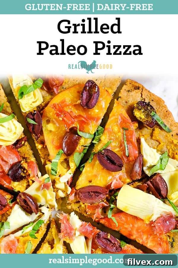 Grilled paleo pizza with heirloom tomatoes, artichoke hearts, kalamata olives, prosciutto and fresh basil long pin, highlighting the gluten-free and dairy-free nature of the recipe.