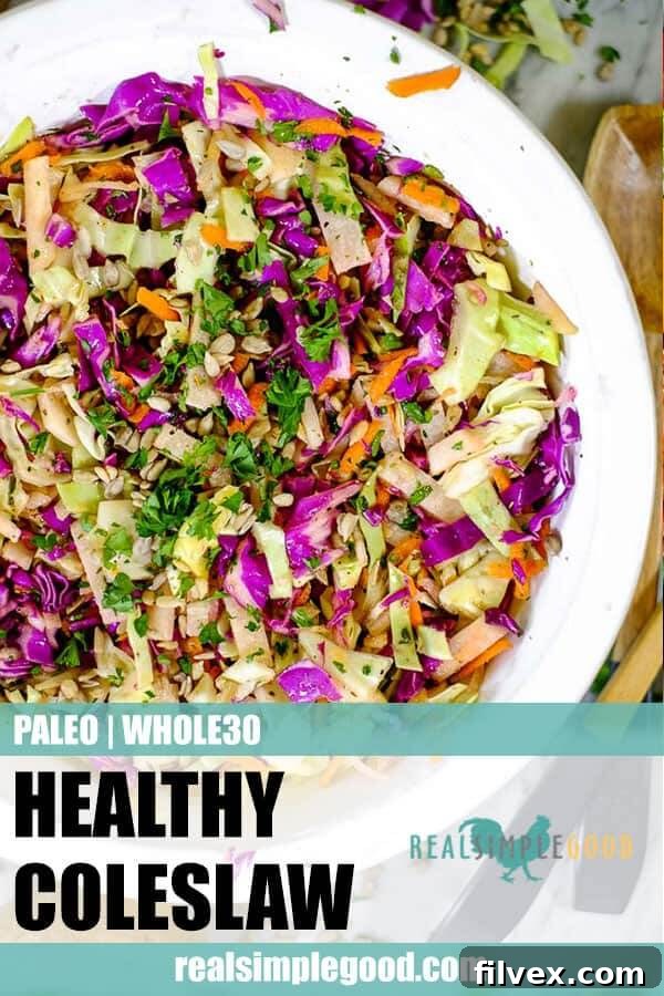 A tall, narrow image of the vibrant Paleo and Whole30 coleslaw in a serving bowl, perfect for pinning to Pinterest. The image highlights the colorful mix of cabbage, carrots, and jicama, appealing to those looking for healthy and easy meal ideas without mayonnaise.