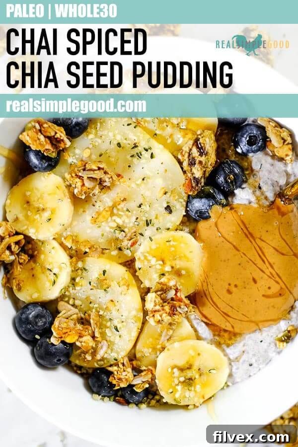 A tall, vertically oriented image for Pinterest, showcasing a beautiful Chai Spiced Paleo Chia Seed Pudding with layered toppings, perfect for sharing and inspiring healthy eating.