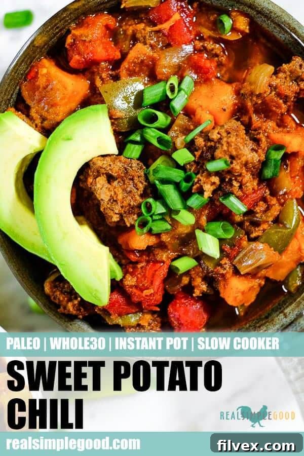 Close up shot of Paleo + Whole30 sweet potato chili in a bowl with chopped green onion and avocado slices. Long pin for pinterest. Pin this recipe for later!